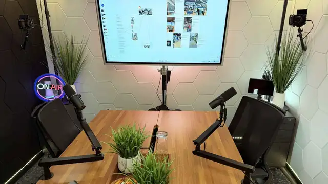 Podcast studio with a large vibe-board display for hosts and guests in San Antonio